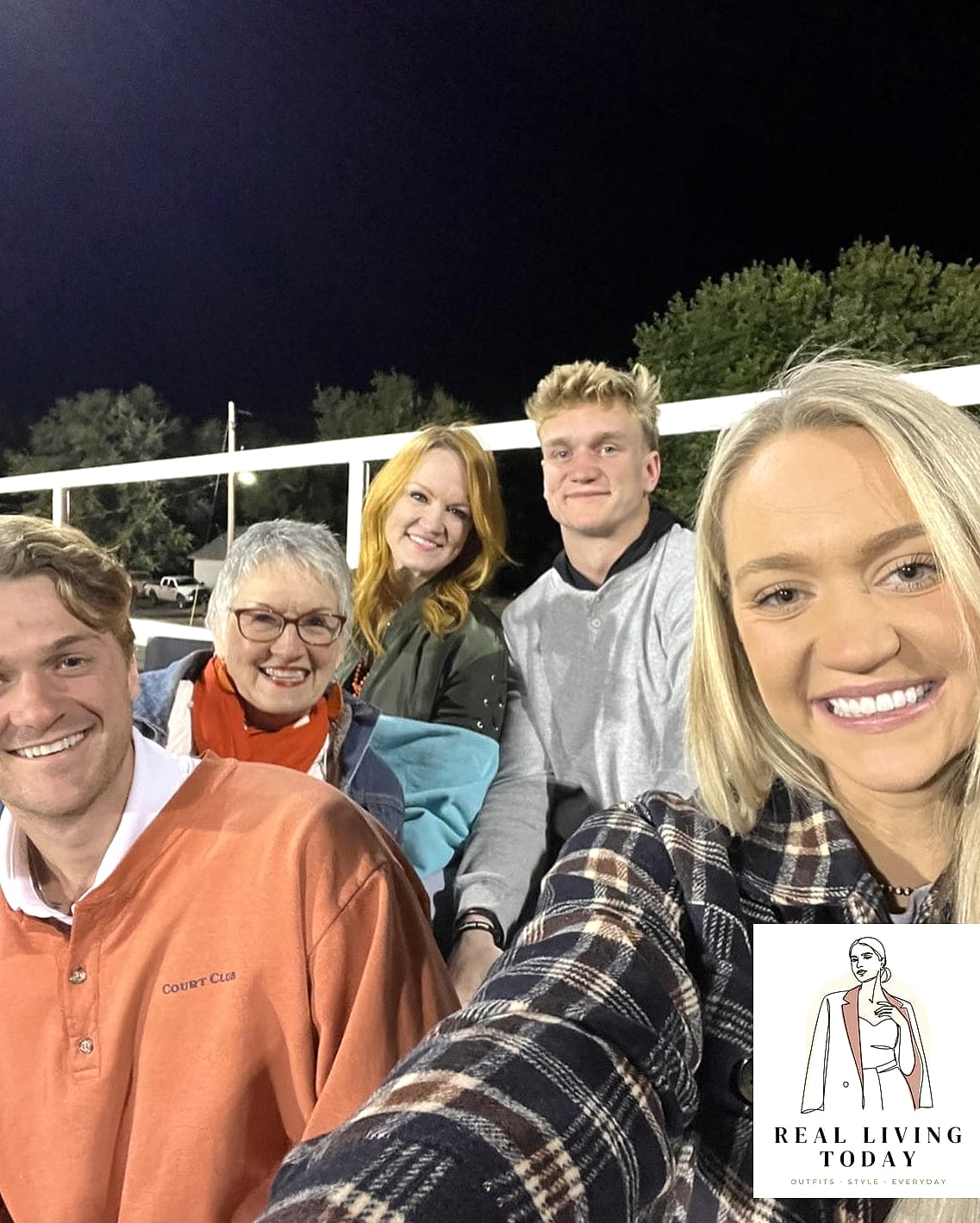 26 Football Game Outfit That Look Effortlessly Chic 4 Flannel Wrapped Around a Hoodie