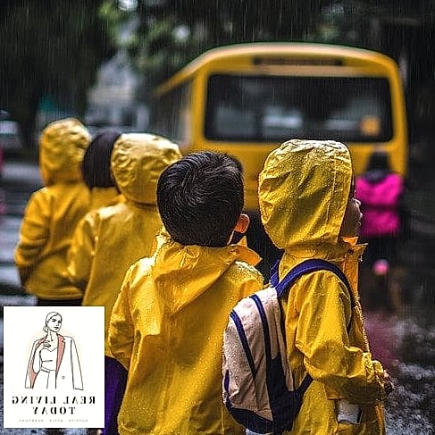 29 Rainy Day Outfit That Actually Look Amazing 4 Yellow Rain Jacket and Wide-Leg Trousers